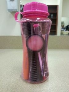 Dancer's survival travel kit: cosmetics in a coffee go-cup. Why not? 