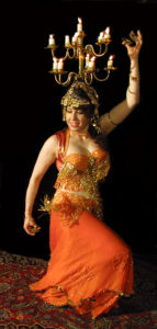 NImeera Nazmine performing with a shamadan (candle headdress); photo courtesy Washington Post. 